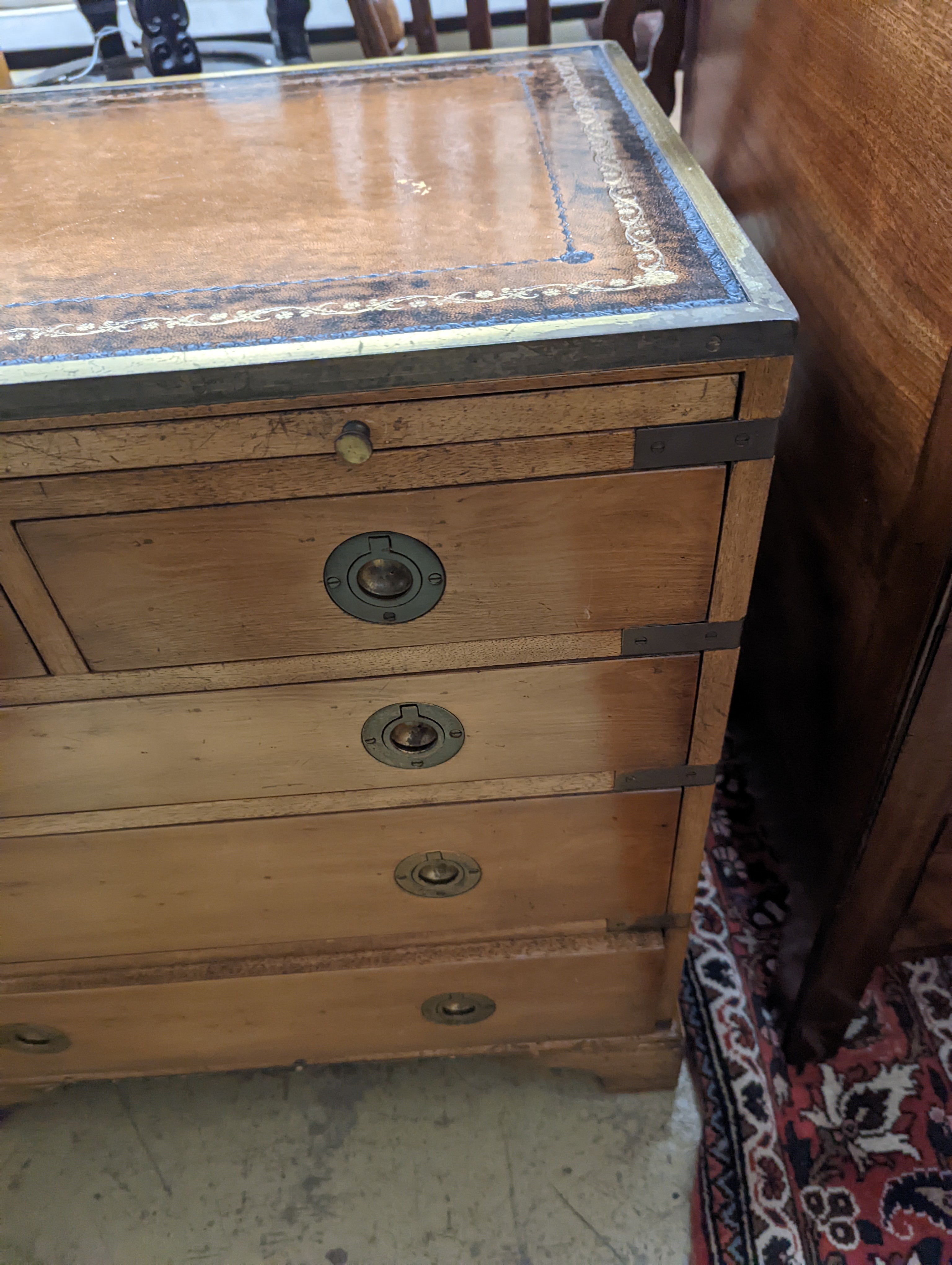 A pair of reproduction brass mounted military style yew veneered bedside chests with leather inset tops, width 56cm, depth 40cm, height 60cm